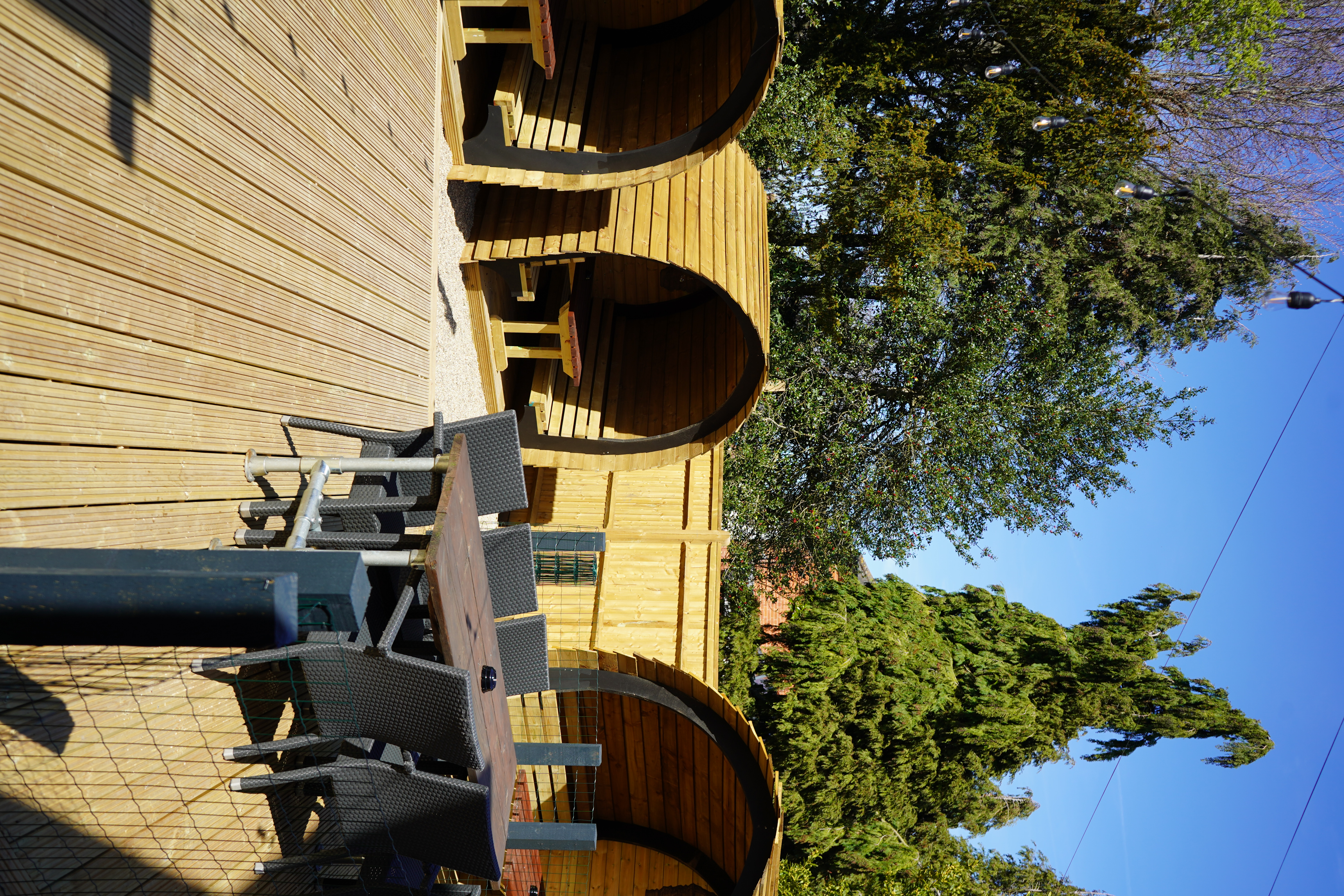 Wooden garden pods with festoon lights