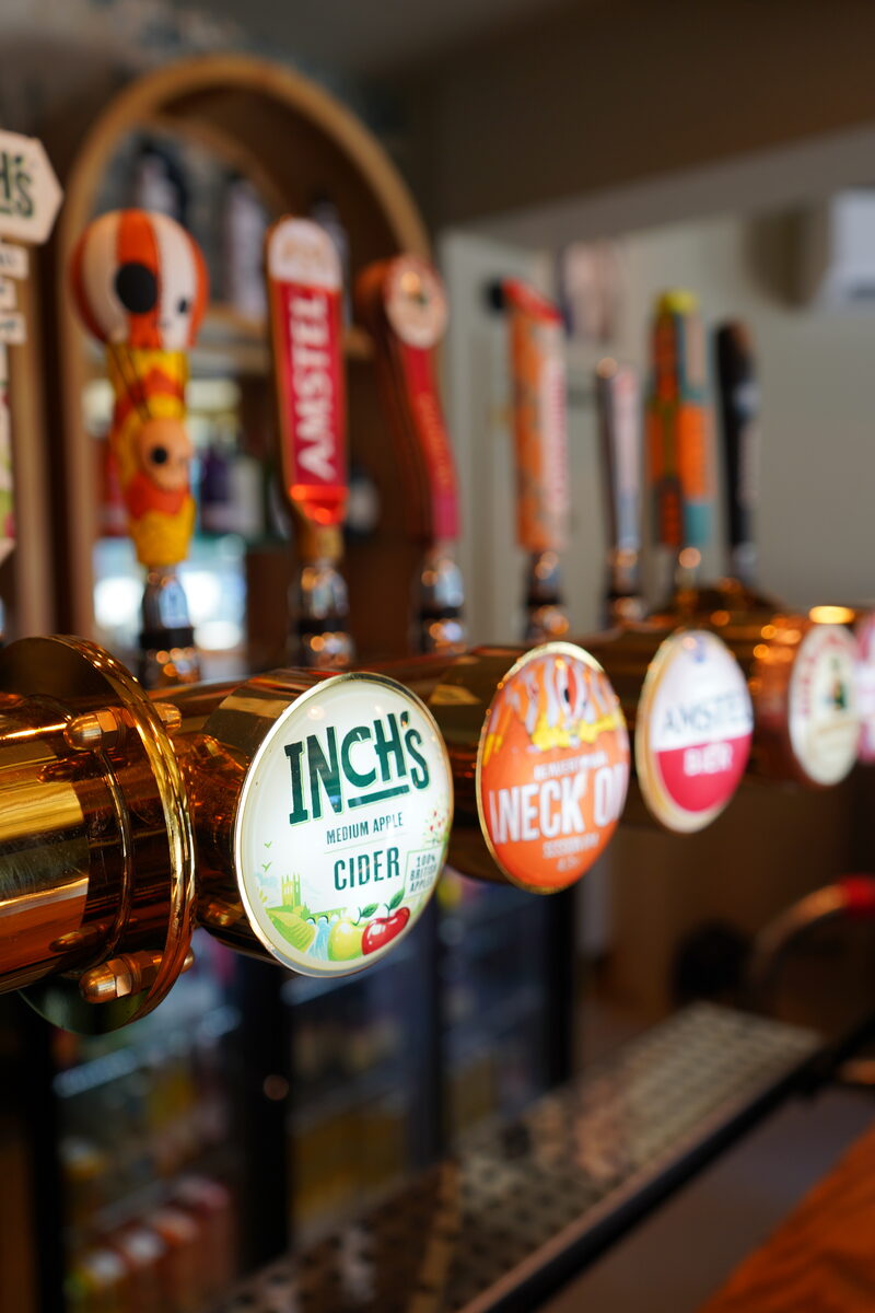 Close-up of brass bar taps
